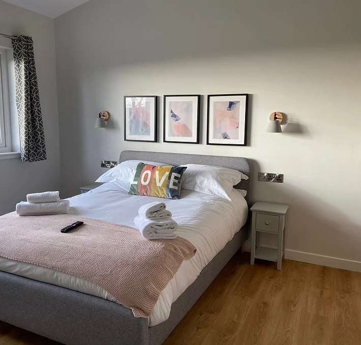 A spacious interior of our luxury lodge showing one of the great bedrooms.
